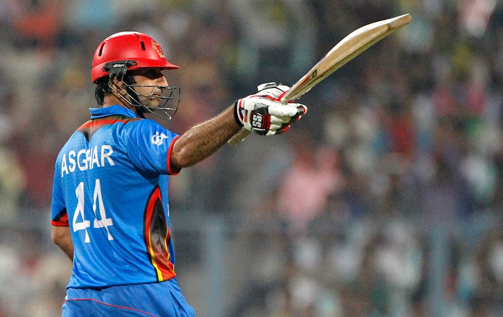 Afghanistan’s Asghar Stanikzai acknowledges the crowd after scoring 50 runs during their match against Sri Lanka at the ICC World Twenty20 2016 cricket tournament in Kolkata.