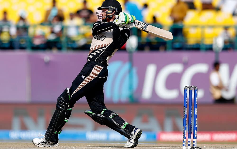 New Zealand's Martin Guptill hits a ball for six runs during their ICC World Twenty20 2016 cricket match against Australia at the Himachal Pradesh Cricket Association (HPCA) stadium in Dharmsala.