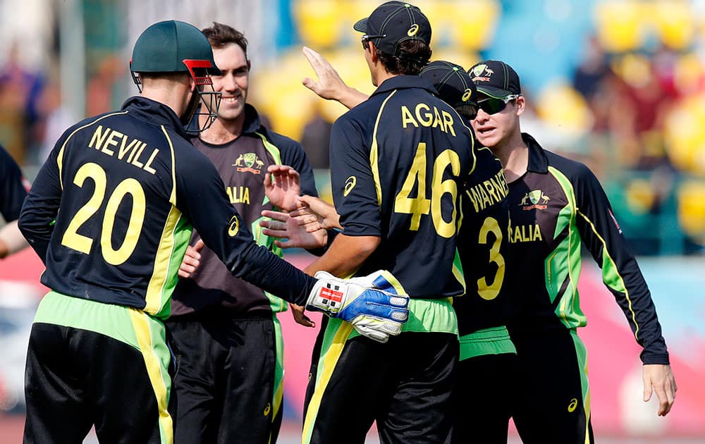 Australia's Ashton Agar celebrates with teammates after catching out New Zealand's Corey Anderson during their ICC World Twenty20 2016 cricket match at the Himachal Pradesh Cricket Association (HPCA) stadium in Dharamsala.