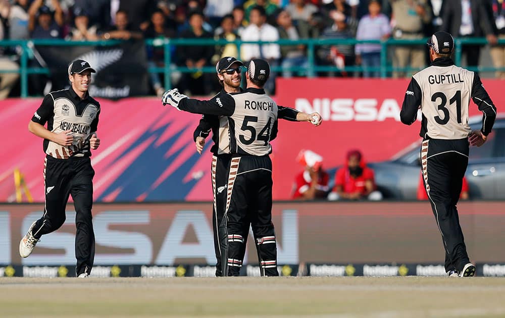 New Zealand player's celebrate the dismissal of Australia's Shane Watson during their ICC World Twenty20 2016 cricket match at the Himachal Pradesh Cricket Association (HPCA) stadium in Dharamsala.