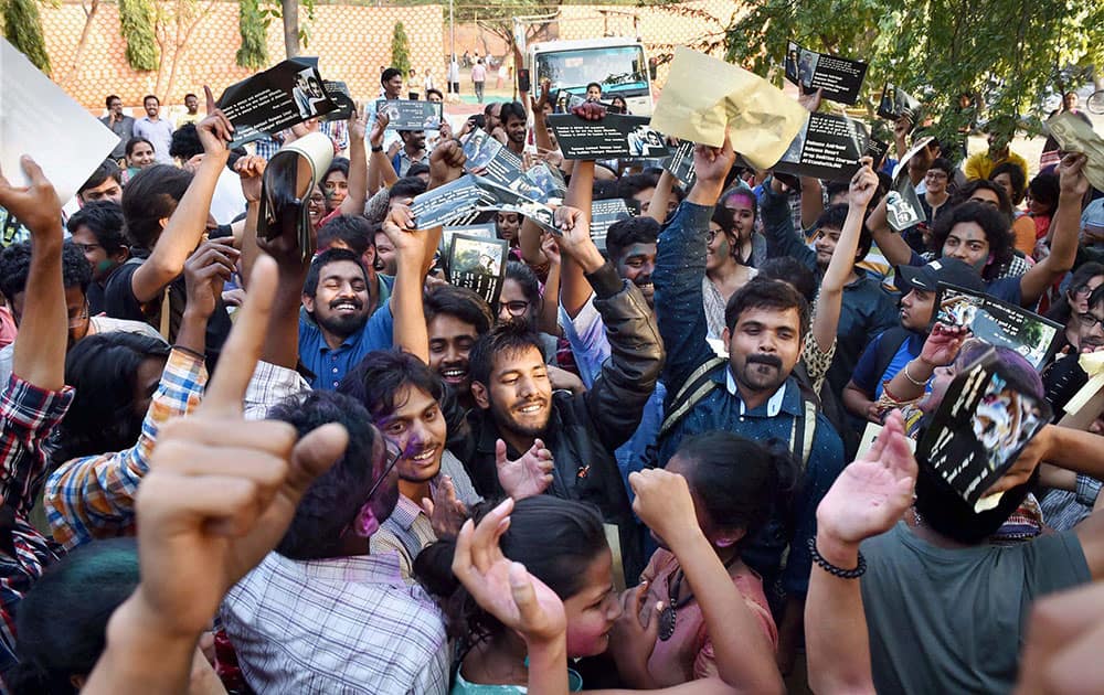 Students celebrate at JNU Campus in New Delhi after Delhi’s Patiala House Court on Friday granted six-month interim bail to JNU students Umar Khalid and Anirban Bhattacharya, slapped with sedition charges.