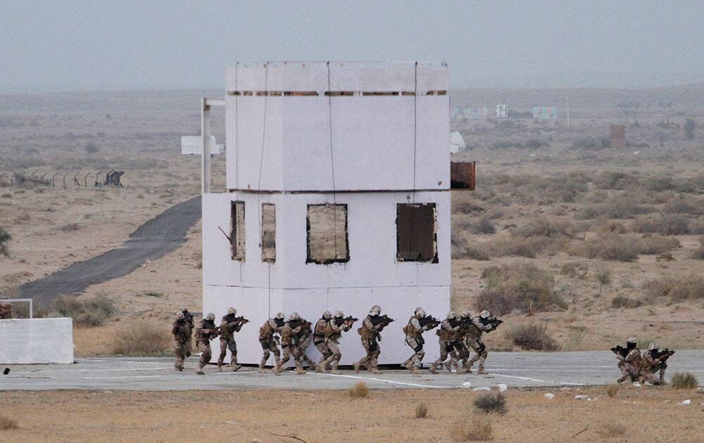Air force commandos perform a mock operation during exercise 'Iron Fist' at Pokhran.