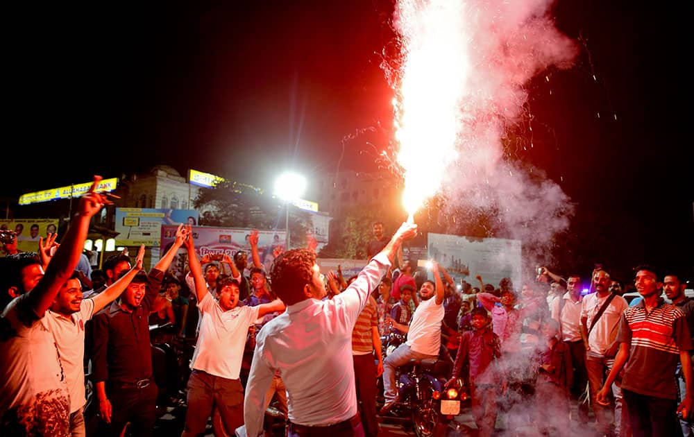 Indian supporters light crackers as they celebrate their team's victory in the ICC World Twenty20 2016 cricket match against Pakistan in Lucknow.