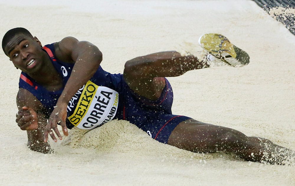 France's Harold Correa lands in the sand after a jump in the men's triple jump final during the World Indoor Athletics Championships.