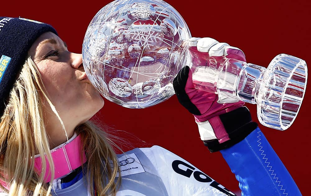 Sweden's Frida Hansdotter kisses her crystal globe trophy after winning the women's slalom discipline title, at the alpine ski, World Cup finals in St. Moritz, Switzerland.