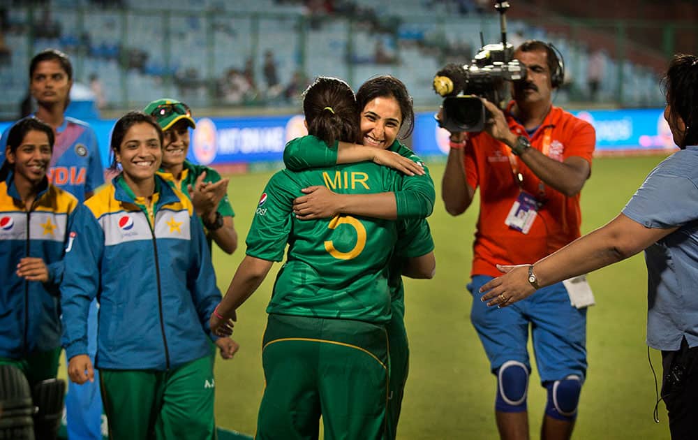 A Pakistani cricket player hugs her captain Sana Mir after they won against India by 2 runs under Duckworth Lewis method in rain affected match during their ICC Women's Twenty20 2016 Cricket World Cup tounament in New Delhi, India.