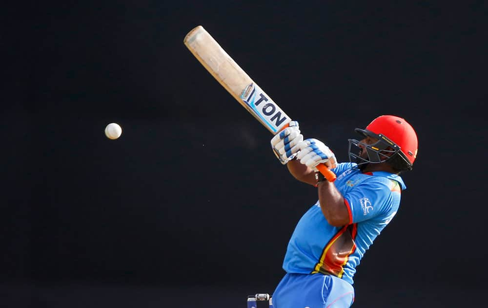 Afghanistan's Shahzad Mohammadi bats against South Africa during their ICC World Twenty20 2016 cricket match at the Wankhede stadium in Mumbai.