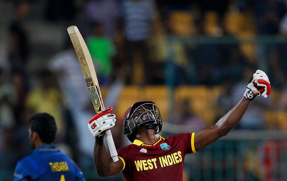 West Indies’ Andre Fletcher celebrates his team's win over Sri Lanka in the ICC World Twenty20 2016 cricket match in Bangalore.