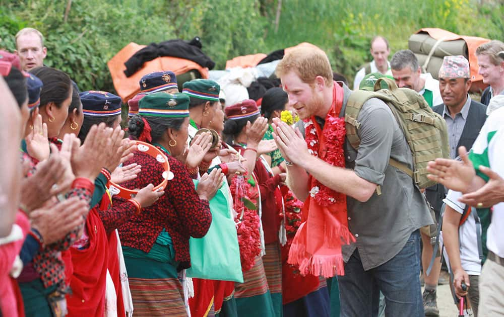 Britain’s Prince Harry is welcomed by the villagers upon his arrival in Lamjung, Nepal.