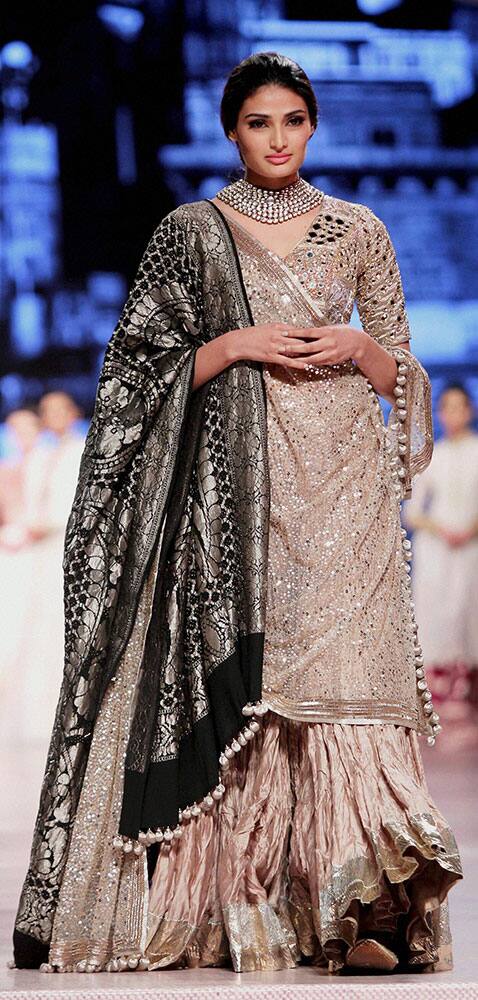 Actress Athiya Shetty walks the ramp during a fashion show in Mumbai.