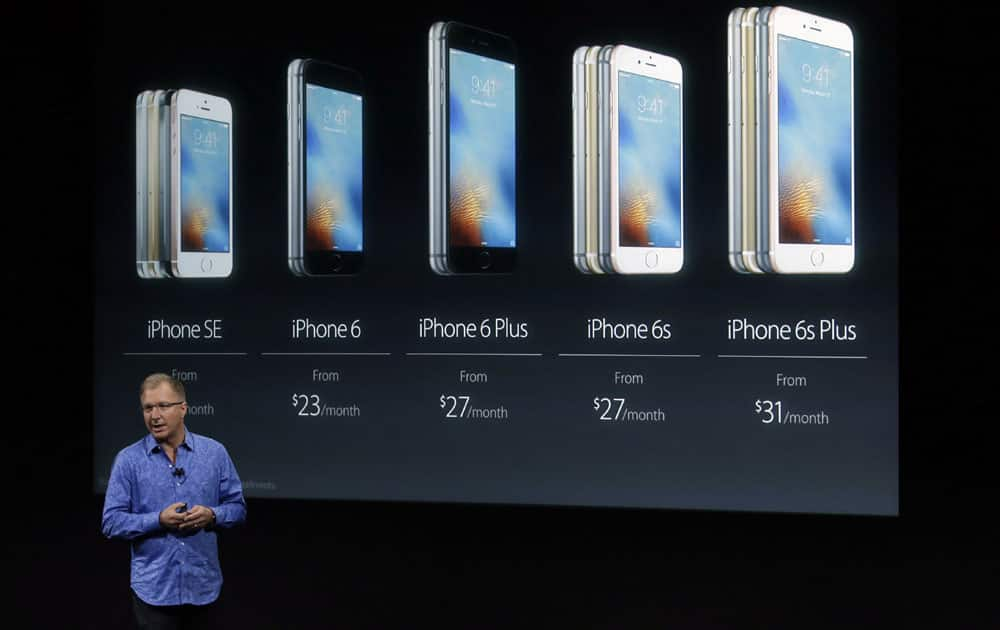 Greg Joswiak, vice president of iOS, iPad and iPhone product marketing, announces the new iPhone SE at Apple headquarters Monday, March 21, 2016, in Cupertino, California.
