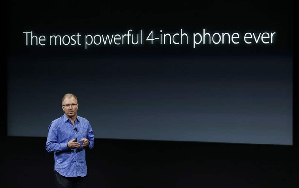 Greg Joswiak, vice president of iOS, iPad and iPhone product marketing, announces the new iPhone SE at Apple headquarters Monday, March 21, 2016, in Cupertino, California.