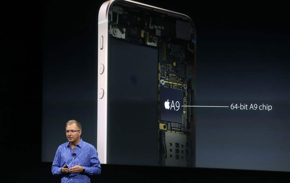 Greg Joswiak, vice president of iOS, iPad and iPhone product marketing, announces the new iPhone SE at Apple headquarters Monday, March 21, 2016, in Cupertino, California.