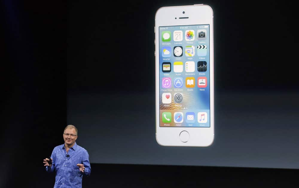 Greg Joswiak, vice president of iOS, iPad and iPhone product marketing, announces the new iPhone SE at Apple headquarters Monday, March 21, 2016, in Cupertino, California.