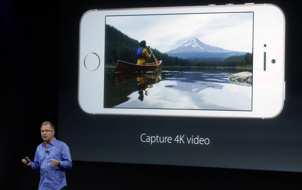 Greg Joswiak, vice president of iOS, iPad and iPhone product marketing, announces the new iPhone SE at Apple headquarters Monday, March 21, 2016, in Cupertino, California.