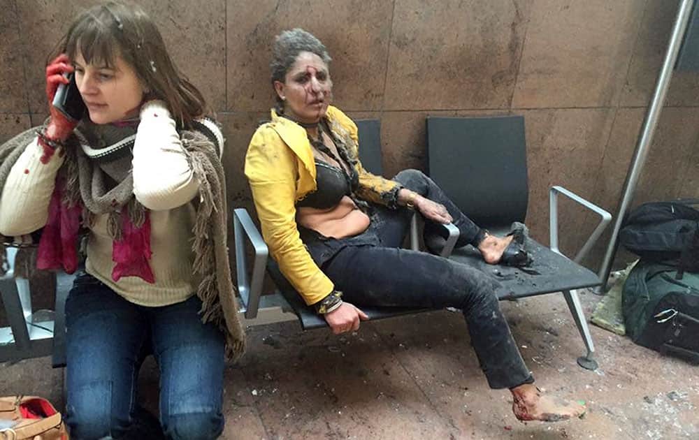 In this photo provided by Georgian Public Broadcaster and photographed by Ketevan Kardava two women wounded in Brussels Airport in Brussels, Belgium, after explosions were heard.
