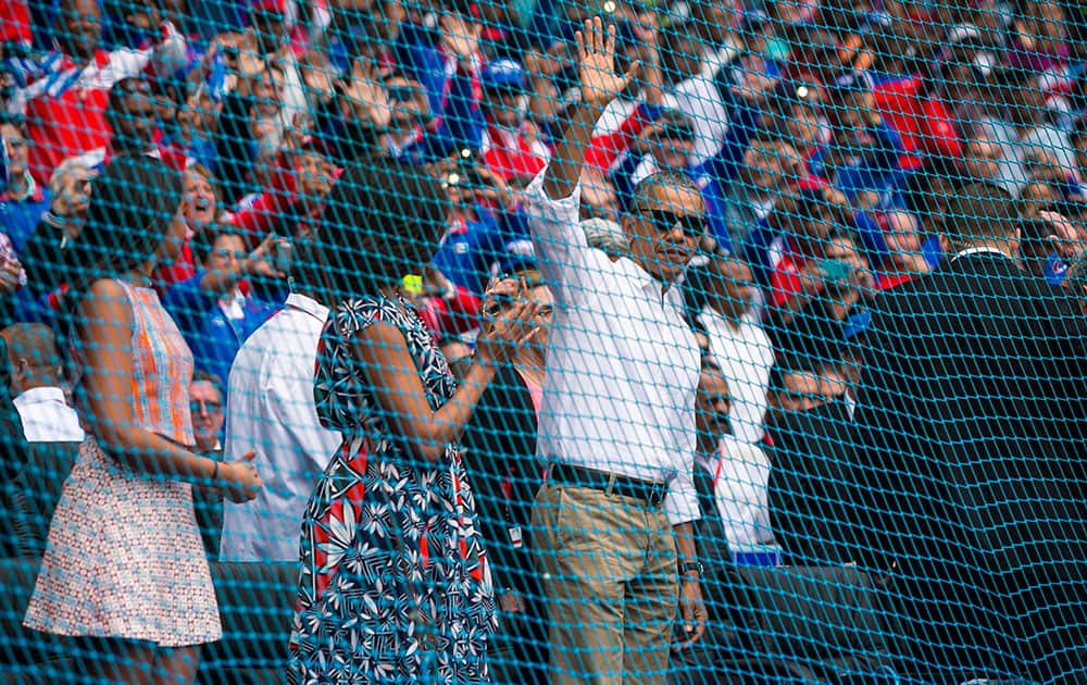President Barack Obama waves to the crowd after arriving for a baseball game between the Tampa Bay Rays and the Cuban national team in Havana, Cuba.