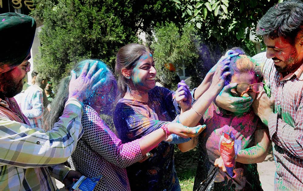 Students celebrate Holi in Amritsar.