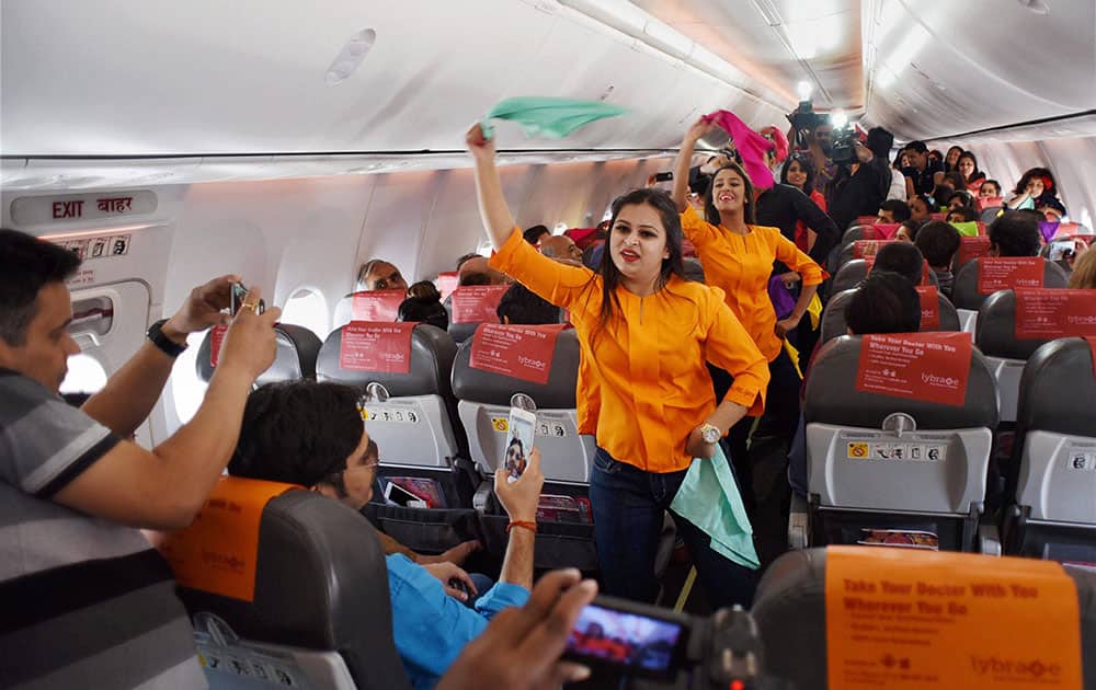 Inflight crew on board a SpiceJet Delhi Goa flight perform a Holi dance post boarding before take off in New Delhi.