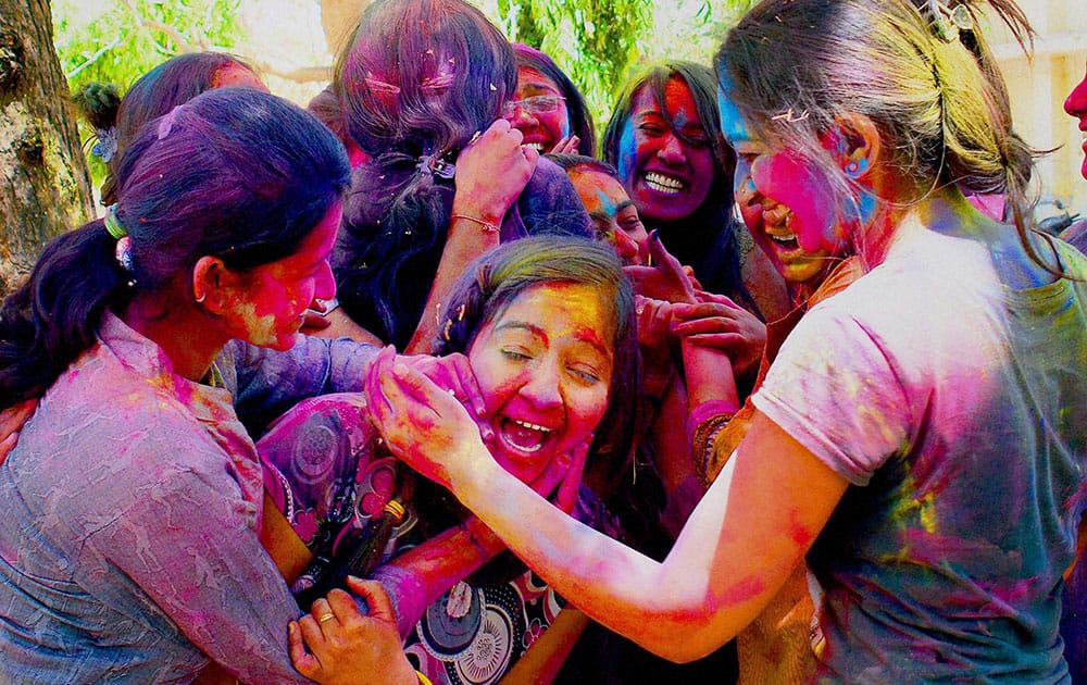 Girls playing Holi in Ahmedabad.