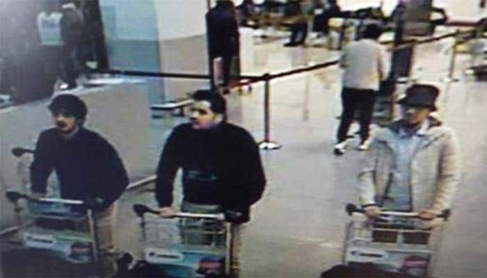 Belgium names Brussels bomber brothers, says key suspect on run