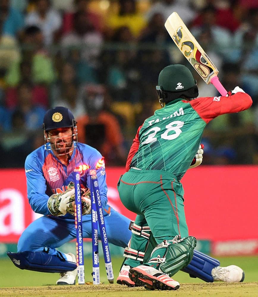 Bangladesh Tamim Iqbal stumped by M S Dhoni during the ICC World T20 match between India and Bangladesh at Chinnaswamy Stadium in Bengaluru.