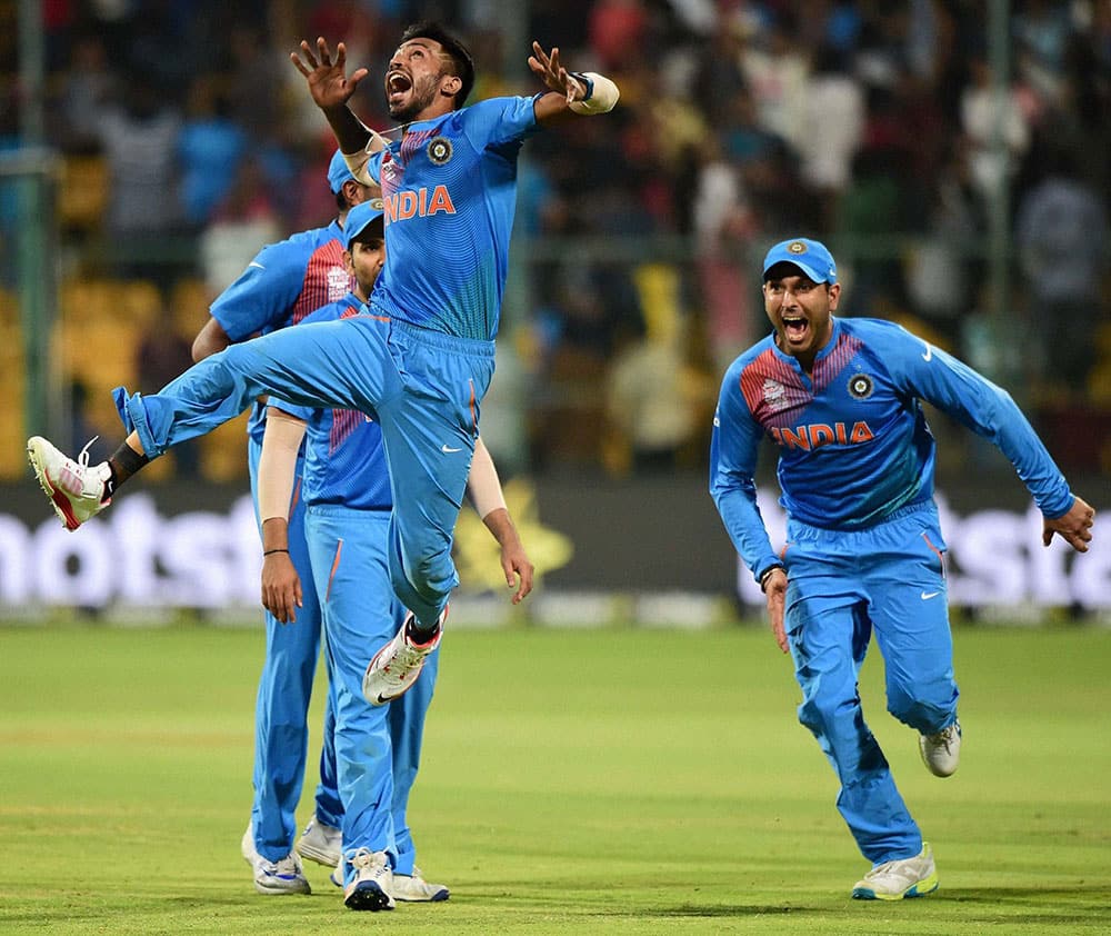 Indias Hardik Pandya with team mates celebrate the win over Bangladesh during the ICC World T20 match between India and Bangladesh at Chinnaswamy Stadium in Bengaluru.