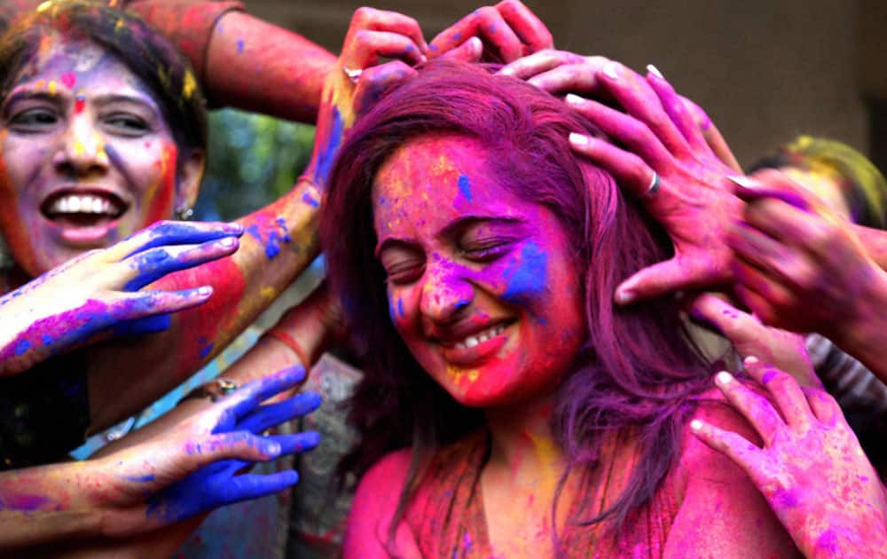 People play Holi in Thane.