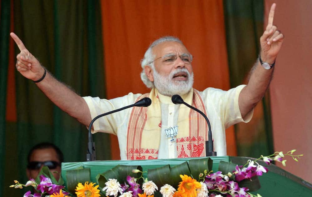 Prime Minister Narendra Modi addresses an election rally at Tinsukia, Assam.