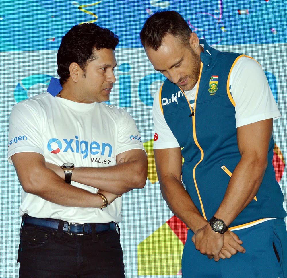 Cricket legend Sachin Tendulkar with South African player Faf du Plessis.
