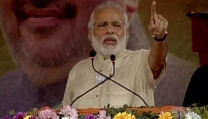 West Bengal Assembly polls 2016: PM Modi hits out at Mamata, pauses his speech for &#039;Aazaan&#039; in Kharagpur