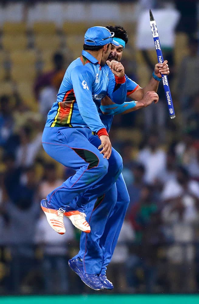 Afghanistan’s Samiullah Shenwari, left, and Hamid Hassan celebrate their win over West Indies’ in the ICC World Twenty20 2016 cricket match in Nagpur.