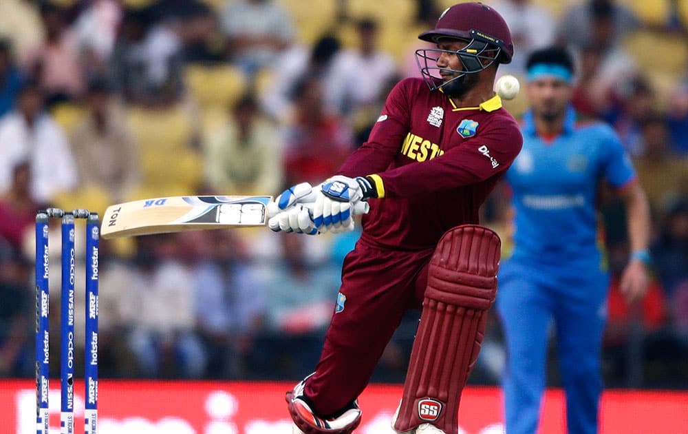 West Indies’ batsman Denesh Ramdin is hit as he miscues a switch-hit during their ICC World Twenty20 2016 cricket match against Afghanistan in Nagpur.
