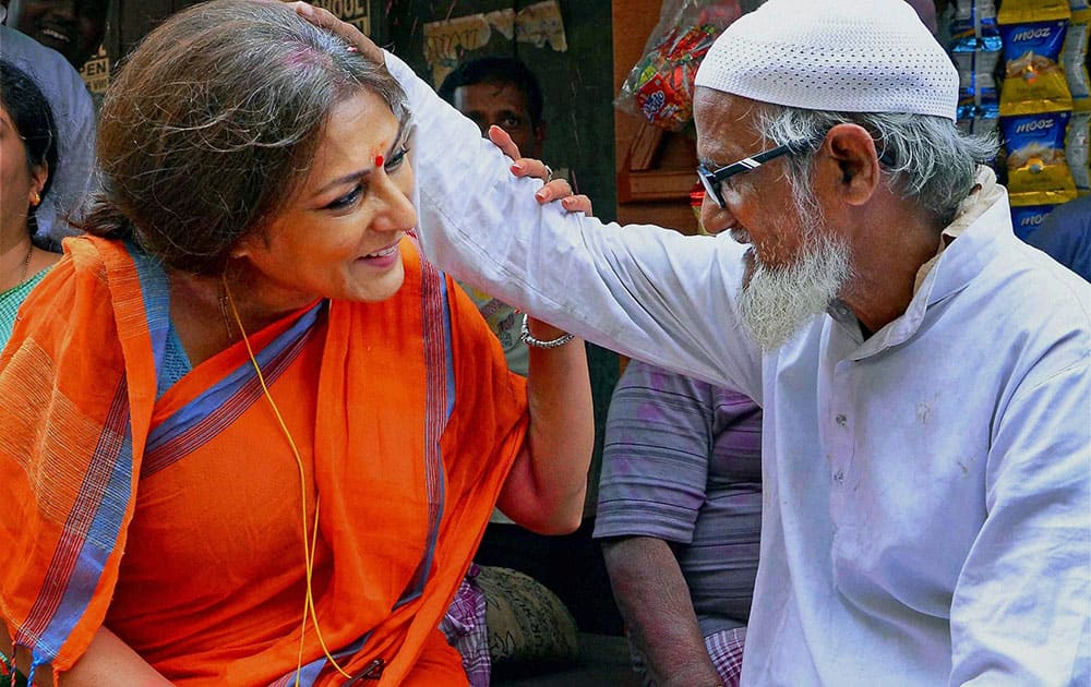 Actress turned BJP leader and party candidate from Howrah-North constituency Rupa Ganguly with an elderly muslim during her election campaign for the upcoming Assembly polls in Howrah.