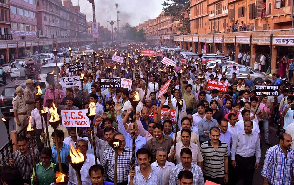 Jewellers take out a torch rally against the proposed hike in excise duty on jewellery in Jaipur.