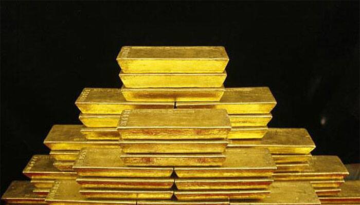 Gold futures drop Rs 72 on weak global cues
