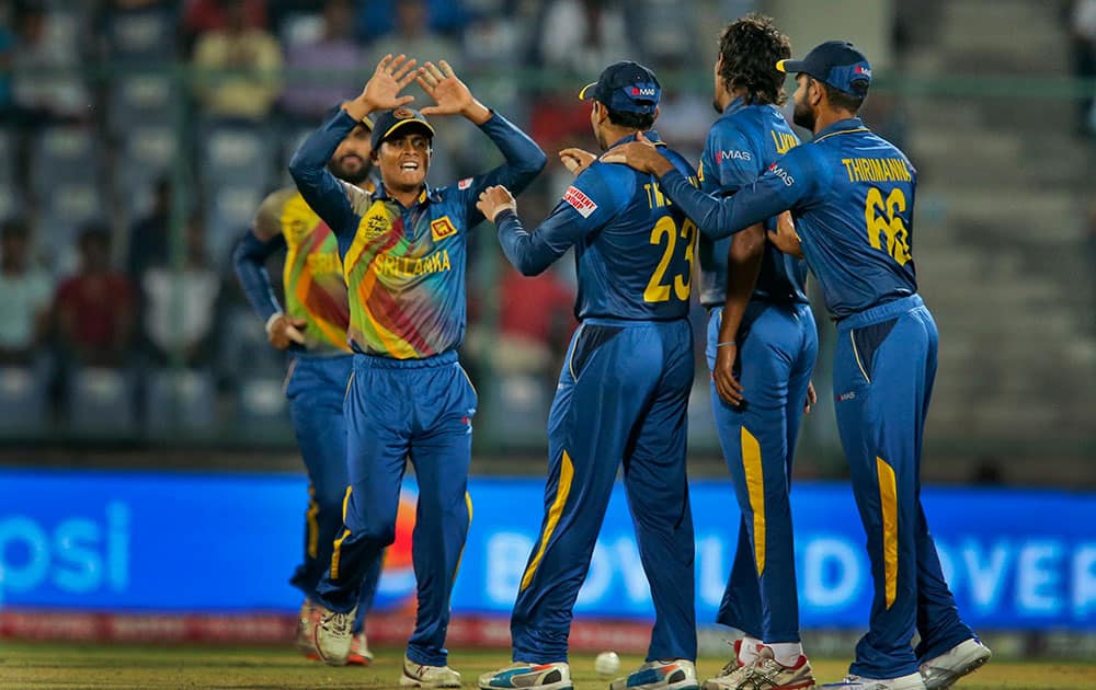 Sri Lankans celebrate the wicket of South Africa's Quinton de Kock during their ICC Twenty20 2016 Cricket World Cup match at the Feroz Shah Kotla Cricket Stadium in New Delhi.