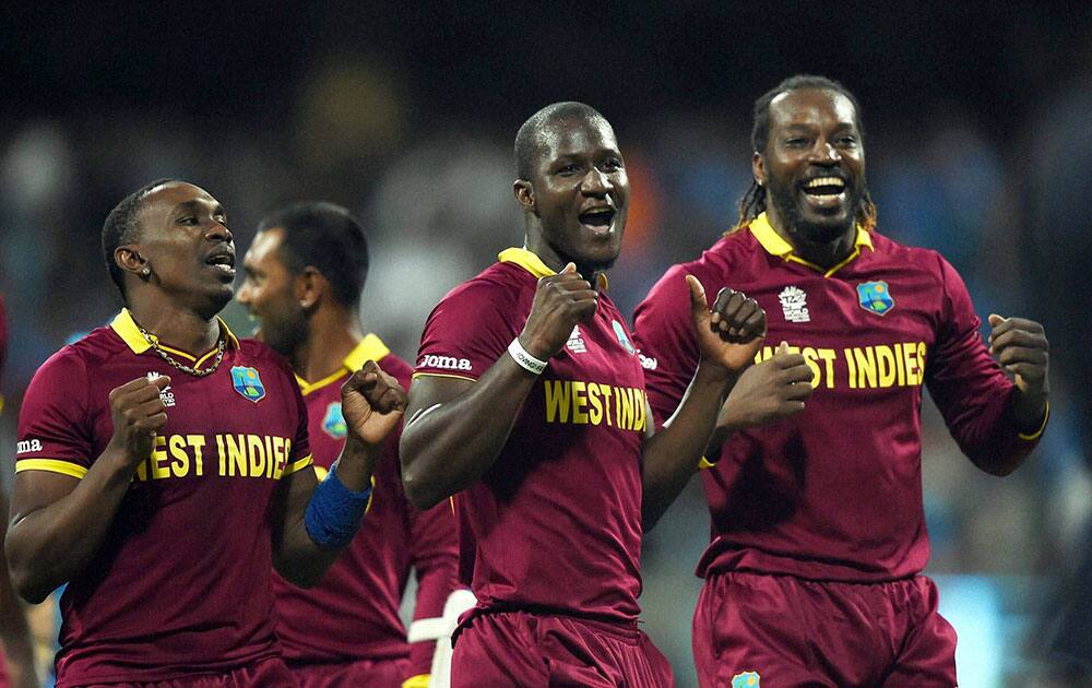 West Indies’ players celebrate the victory during ICC WT20 Semi Final match against India at Wankhede Stadium in Mumbai.