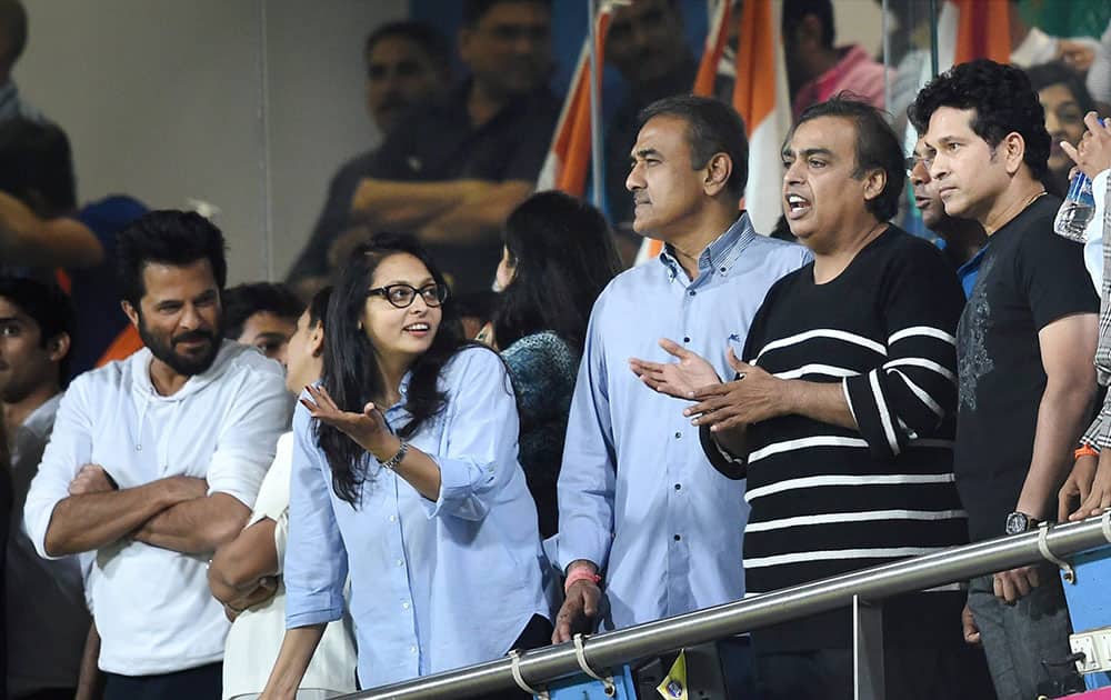 Actor Anil Kapoor, NCP leader Praful Patel, Industrialist Mukesh Ambani and cricket legend Sachin Tendulkar watching the ICC WT20 Semi Final match between India and West Indies at Wankhede Stadium in Mumbai.