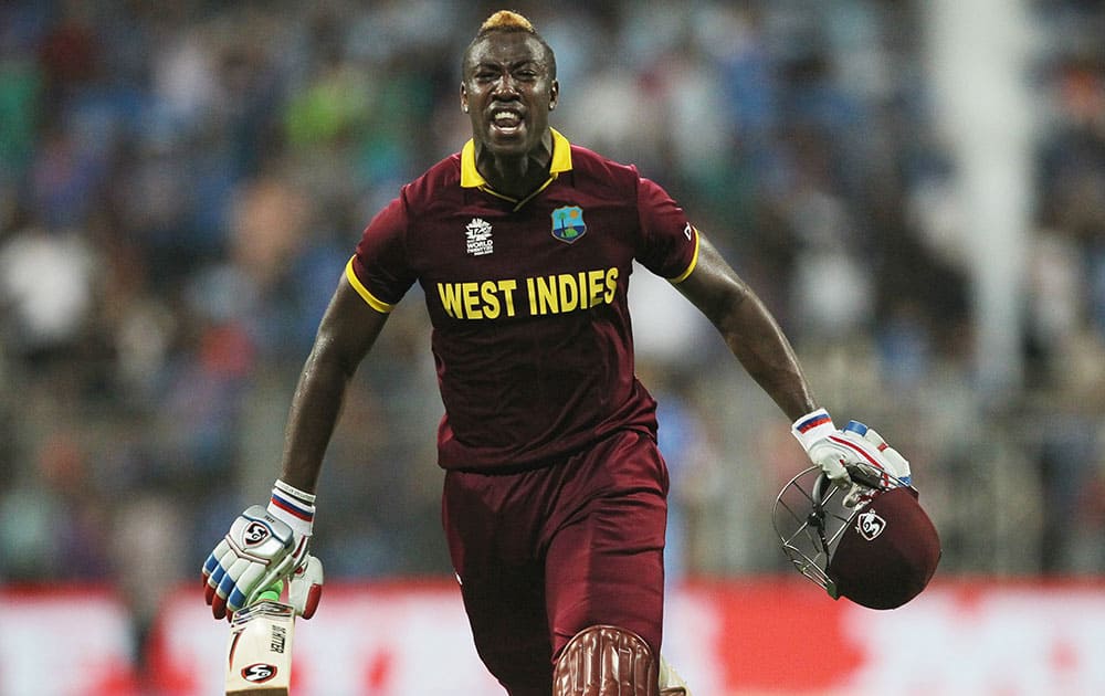 West Indies Andre Russell celebrates after his team's win over India during their ICC World Twenty20 2016 cricket semifinal match at Wankhede stadium in Mumbai.