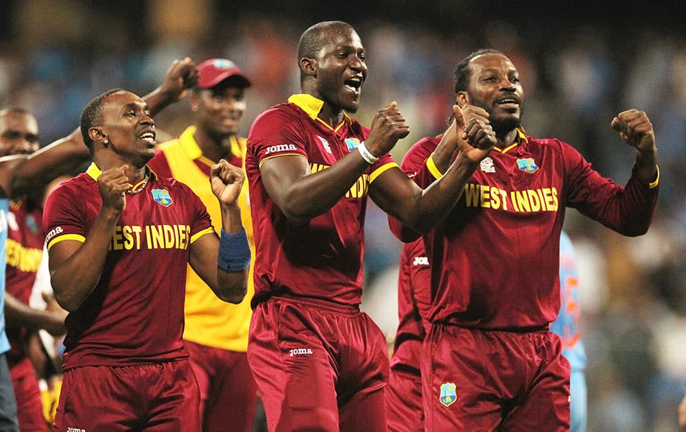 West Indies players celebrate after their seven wicket win over India in their ICC World Twenty20 2016 cricket semifinal match at Wankhede stadium in Mumbai.