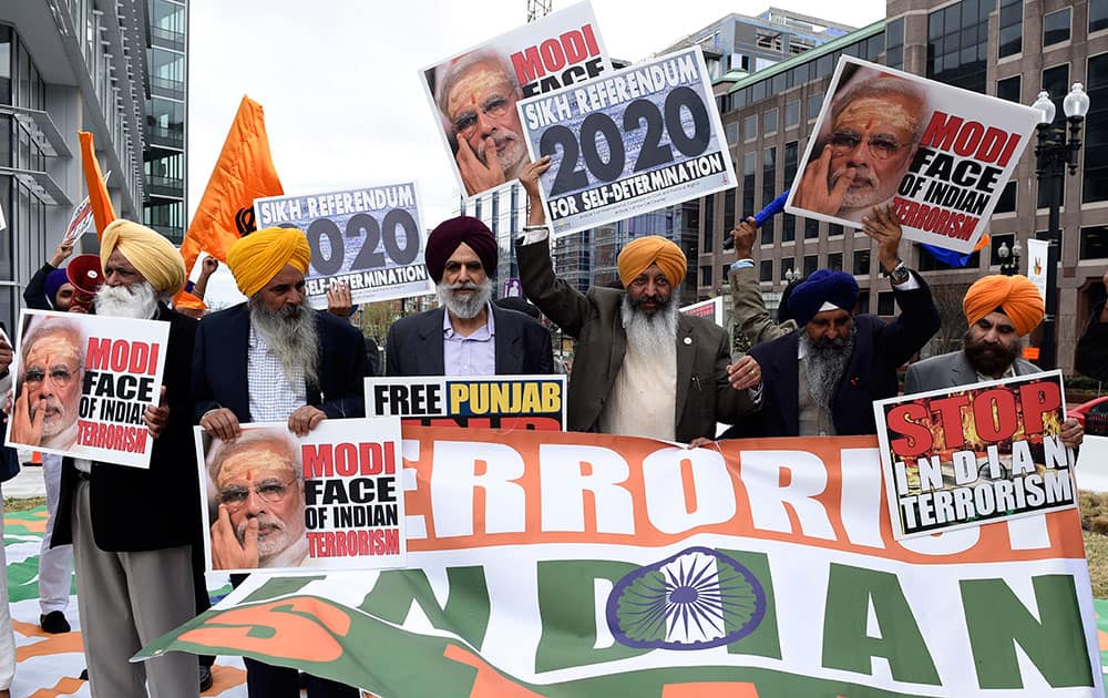 Sikhs protesting religious intolerance and wanting independence for Punjab gather outside the Convention Center in Washington.