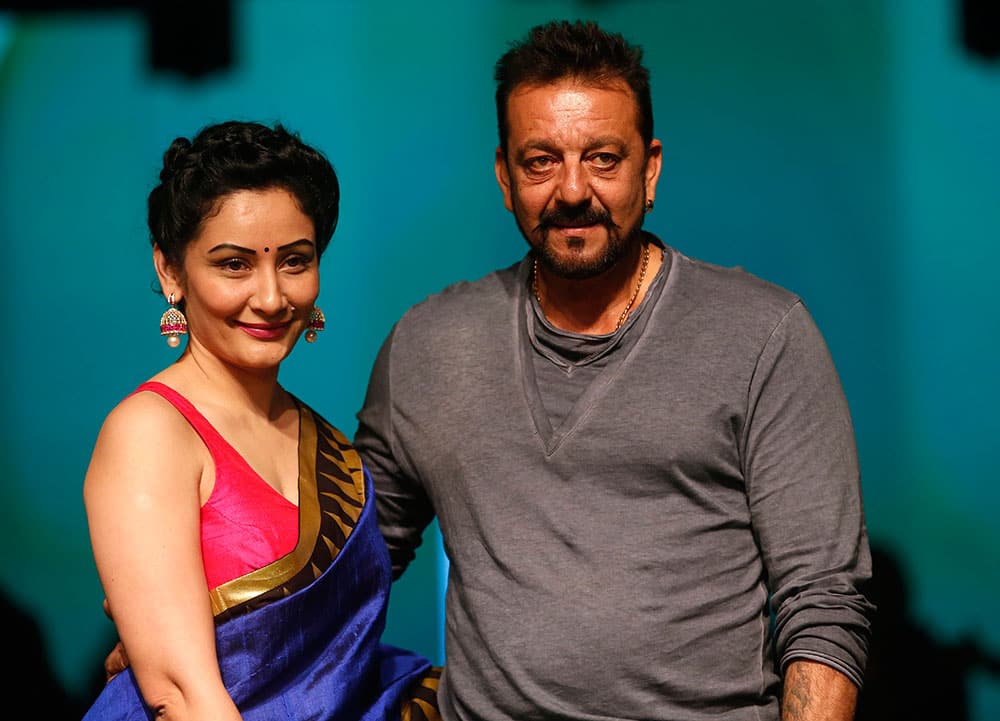 Bollywood actor Sanjay Dutt and his wife Manyata pose for the media during the Lakme Fashion Week in Mumbai.