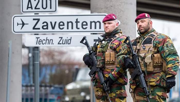Brussels airport reopens with three flights, tighter security