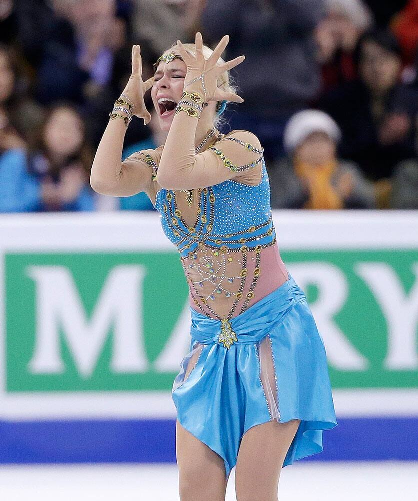Anna Pogorilaya, of Russia, reacts after competing during the free skate in the World Figure Skating Championships, in Boston.
