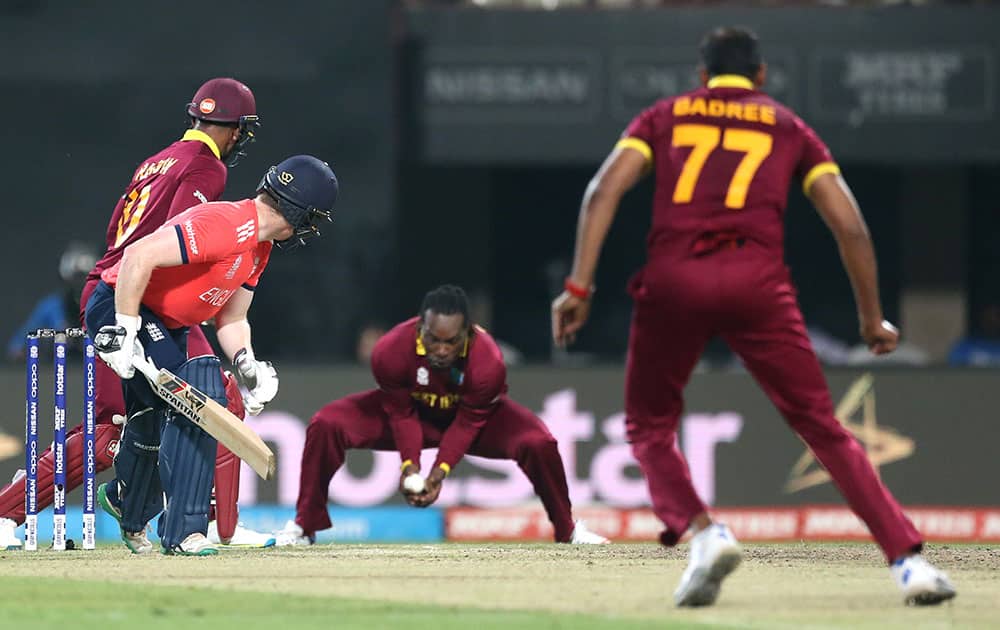 England's Eoin Morgan, watches West Indies Chris Gayle take a catch to dismiss him during the final of the ICC World Twenty20 2016 cricket tournament at Eden Gardens in Kolkata.