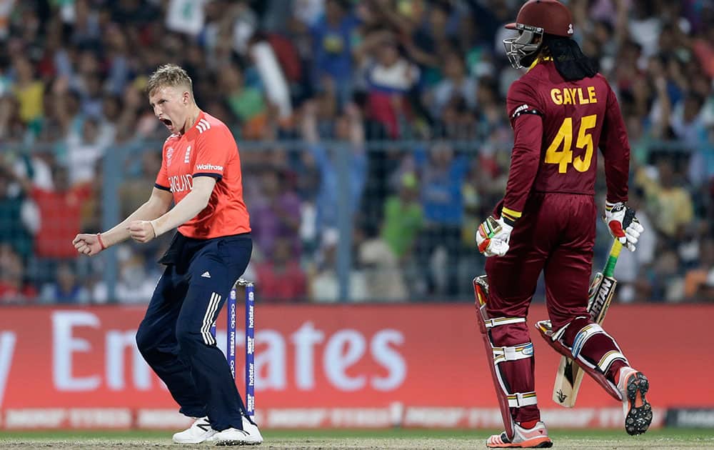 England's Joe Root celebrates the dismissal of West Indies Chris Gayle during the final of the ICC World Twenty20 2016 cricket tournament at Eden Gardens in Kolkata.