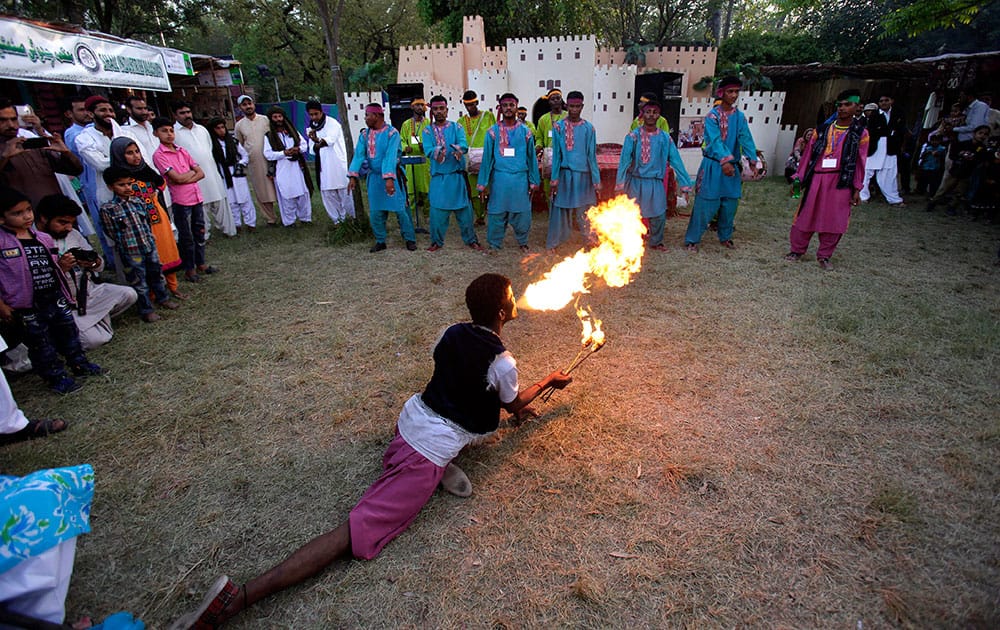 A performer breathes fire during a cultural festival in Islamabad, Pakistan.