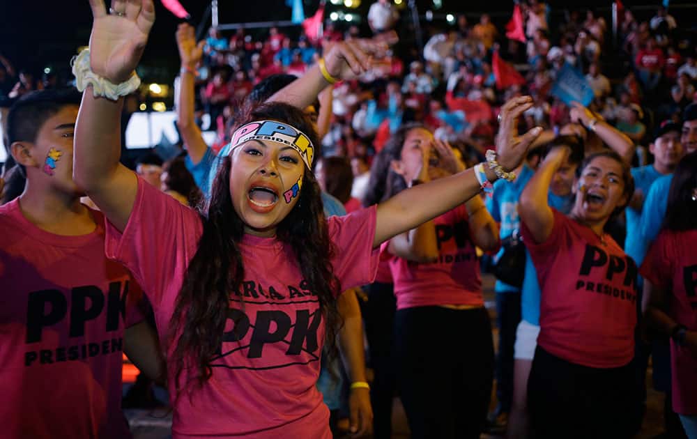 Supporters of Presidential candidate Pedro Pablo Kuczynski of the 'Peruanos por el Kambio' political party attend his closing presidential campaign rally in Lima, Peru