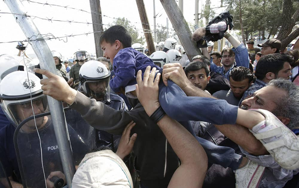 Migrants clash with Greek police during a protest against the closed border with Macedonia, at the northern Greek border point of Idomeni, Greece.